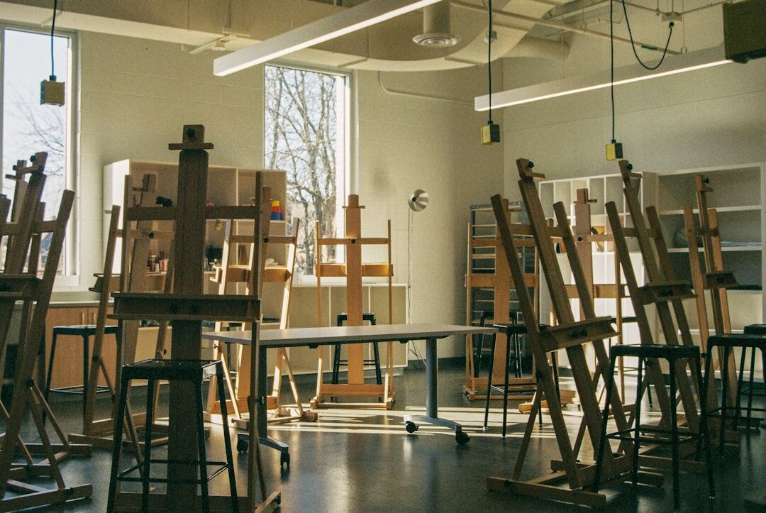 Seniors painting and creating art together in a bright workshop room