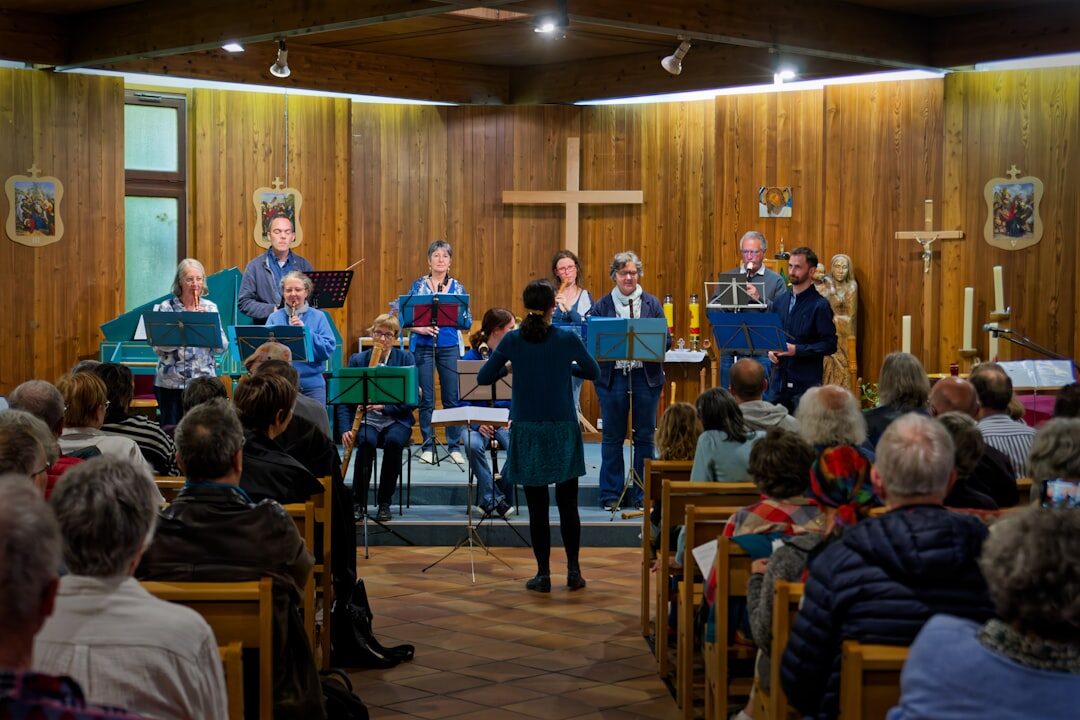 Group of seniors singing together in a choir at a community event